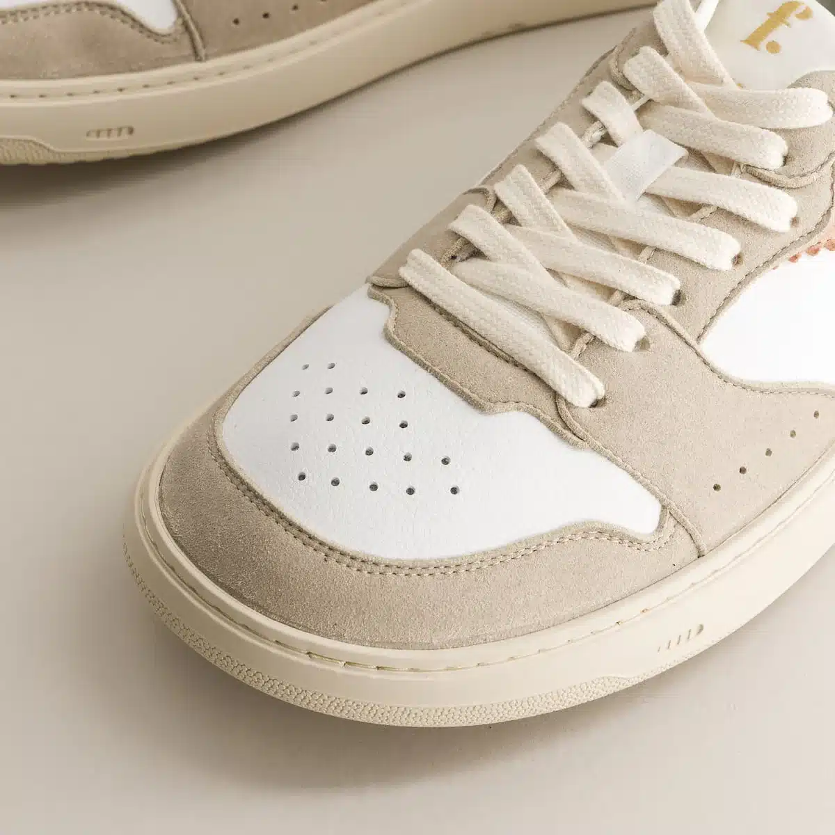 Fleeters Mango Pink barefoot sneakers close up detail showing GrapeSkin leather and embroidered logo