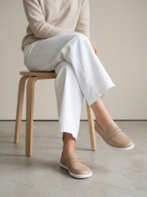 Woman wearing brown minimalist loafers with a casual everyday outfit