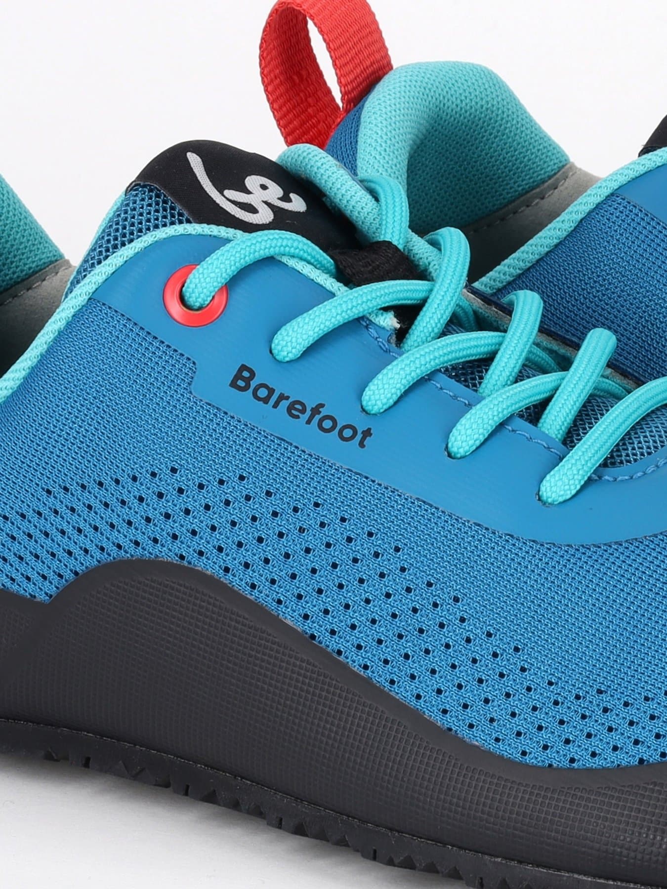 Close up of breathable aqua blue technical mesh and synthetic overlays