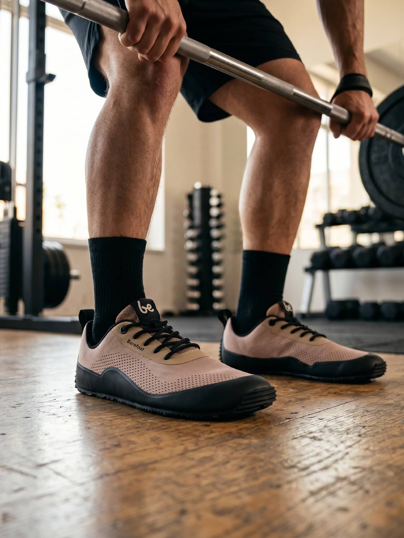 Person training at the gym wearing earthy terracotta barefoot trainers