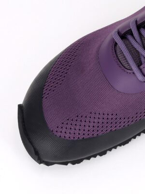 Close up of breathable plum purple technical mesh and synthetic overlays